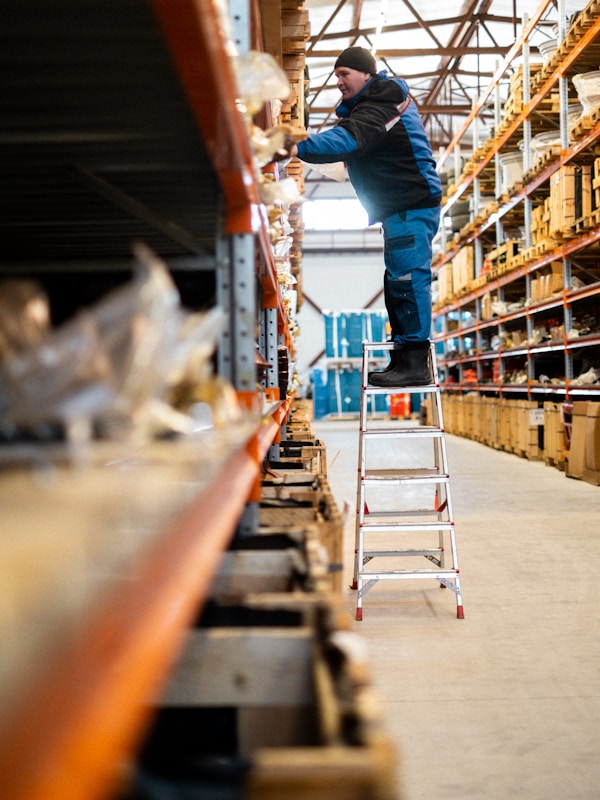 Worker scanning a parcel for delivery